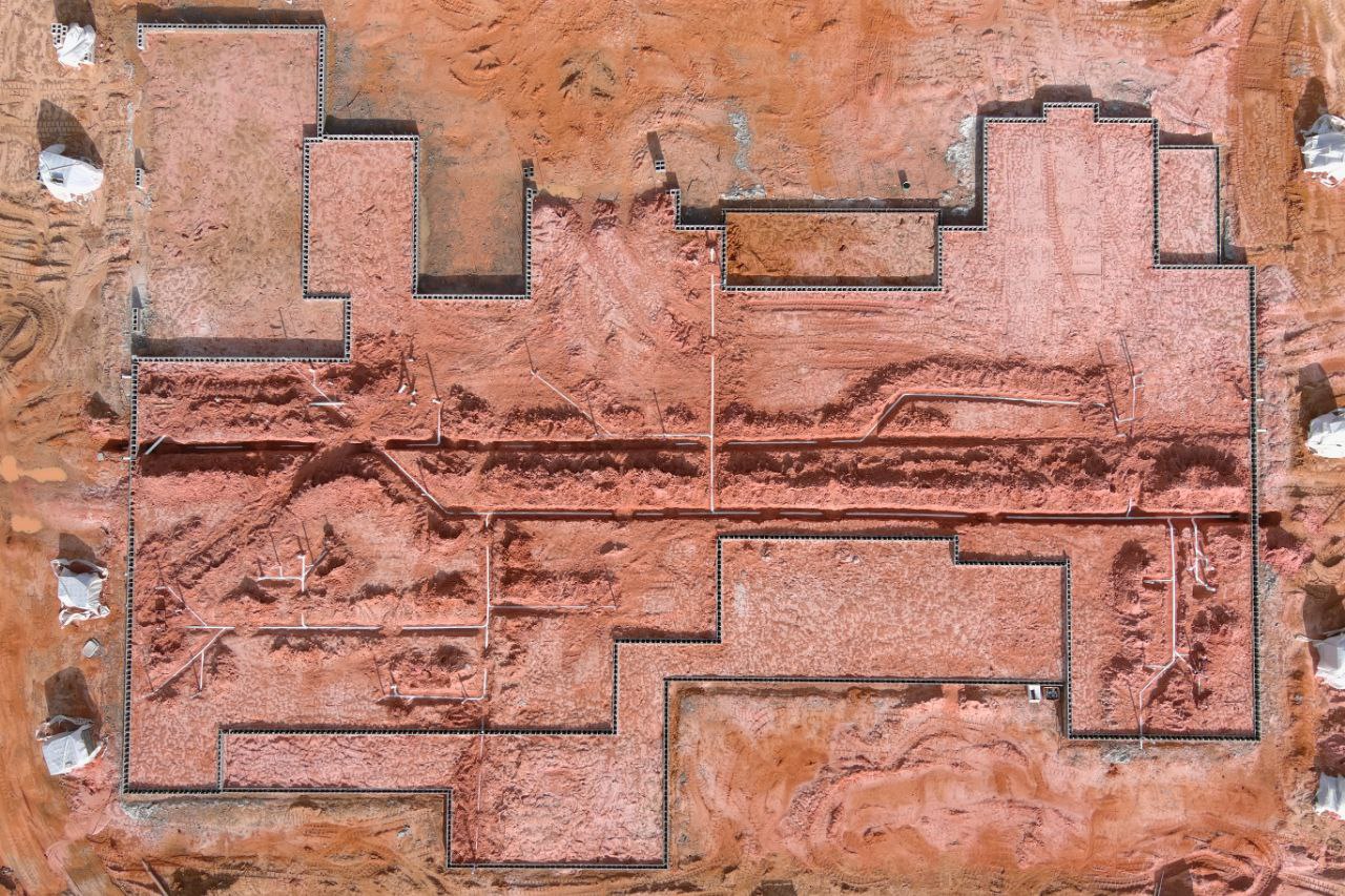 Overhead view of new-construction underground plumbing